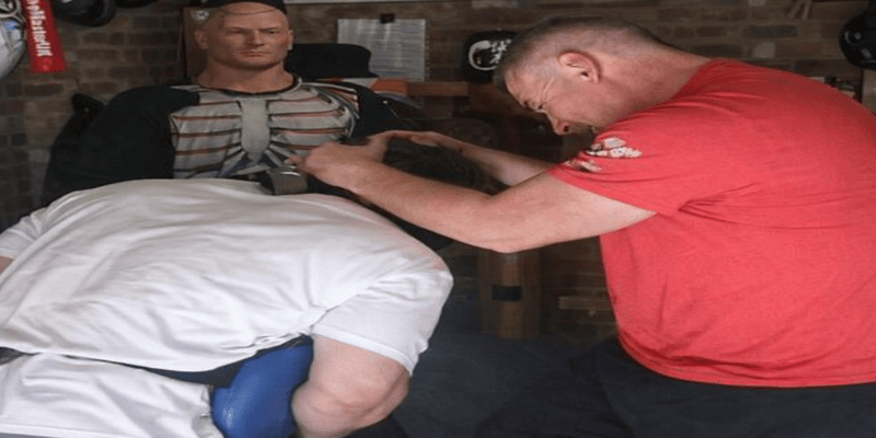 "Student receiving personalized one-on-one martial arts training from an expert instructor, focusing on technique and skill development."