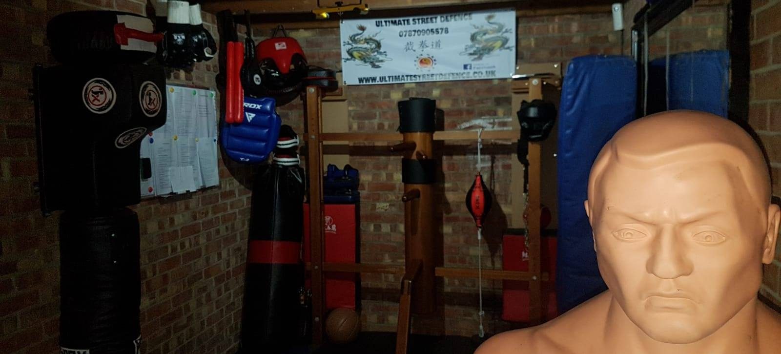 Private self defence gym in Basildon with training mats, punch bags and martial arts equipment.